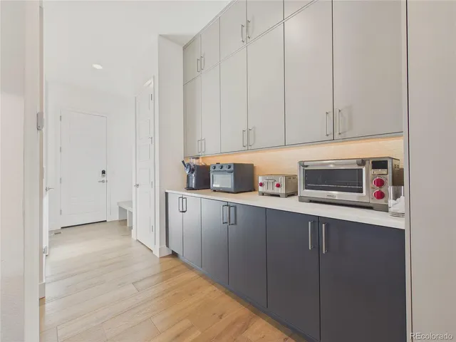 a kitchen with stainless steel appliances granite countertop a refrigerator sink and cabinets