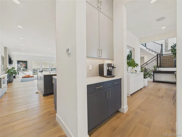 a kitchen with stainless steel appliances a refrigerator sink and cabinets