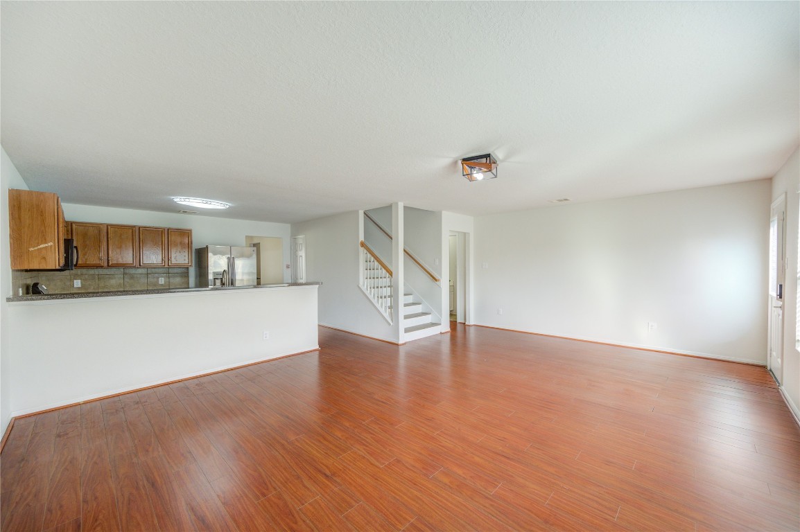 18434 Ranch View Trail Houston, TX 77073 - Photo 12 of 35 a view of empty room with wooden floor