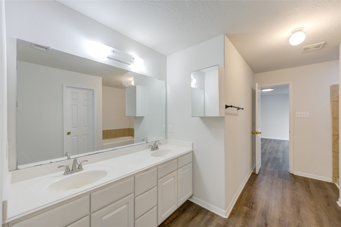 18434 Ranch View Trail Houston, TX 77073 - Photo 20 of 35 a bathroom with double vanity sink and a mirror