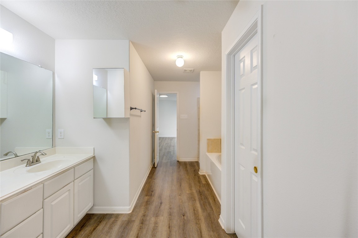 18434 Ranch View Trail Houston, TX 77073 - Photo 21 of 35 a bathroom with a sink and a mirror
