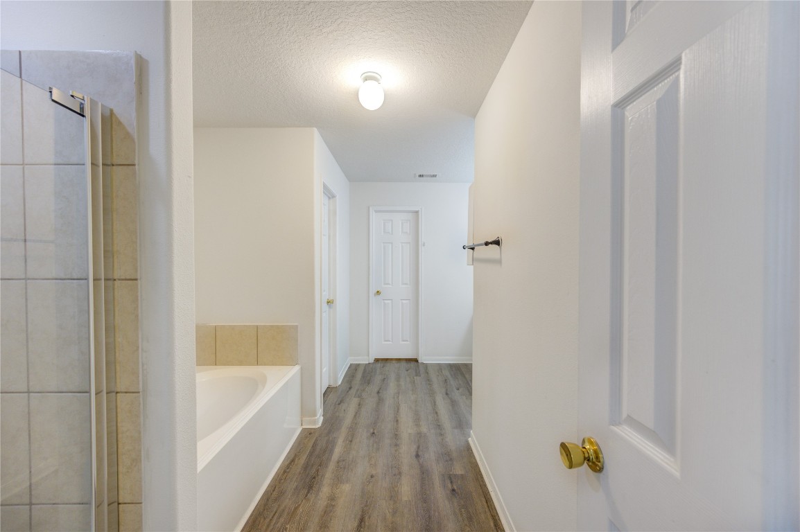 18434 Ranch View Trail Houston, TX 77073 - Photo 22 of 35 a bathroom with a bathtub and shower