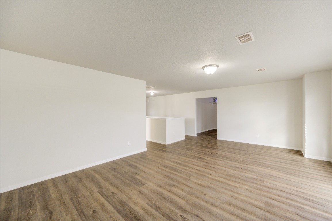 18434 Ranch View Trail Houston, TX 77073 - Photo 26 of 35 a view of an empty room with wooden floor