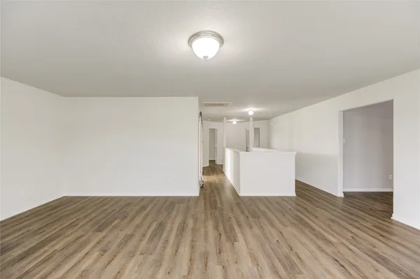 a view of kitchen and wooden floor