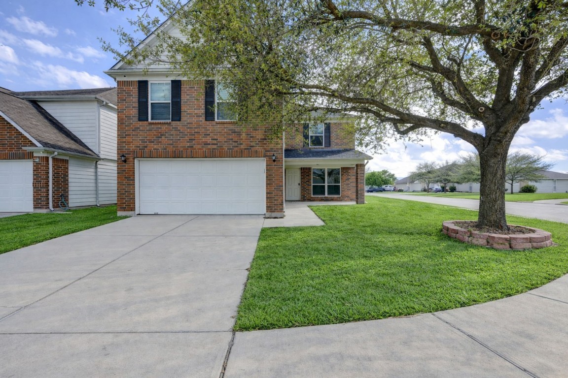 18434 Ranch View Trail Houston, TX 77073 - Photo 3 of 35 a front view of a house with garden