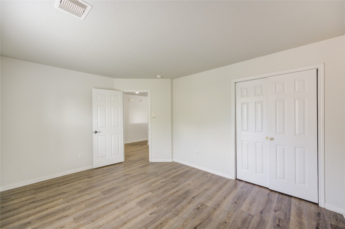 18434 Ranch View Trail Houston, TX 77073 - Photo 31 of 35 a view of an empty room with wooden floor