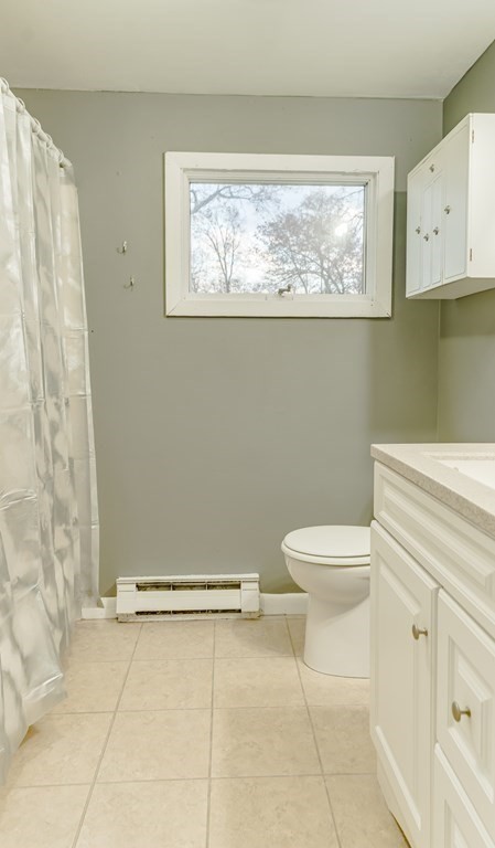 67 Sierra Vista Road Springfield, MA 01128 - Photo 13 of 21 a bathroom with a toilet a sink and a window