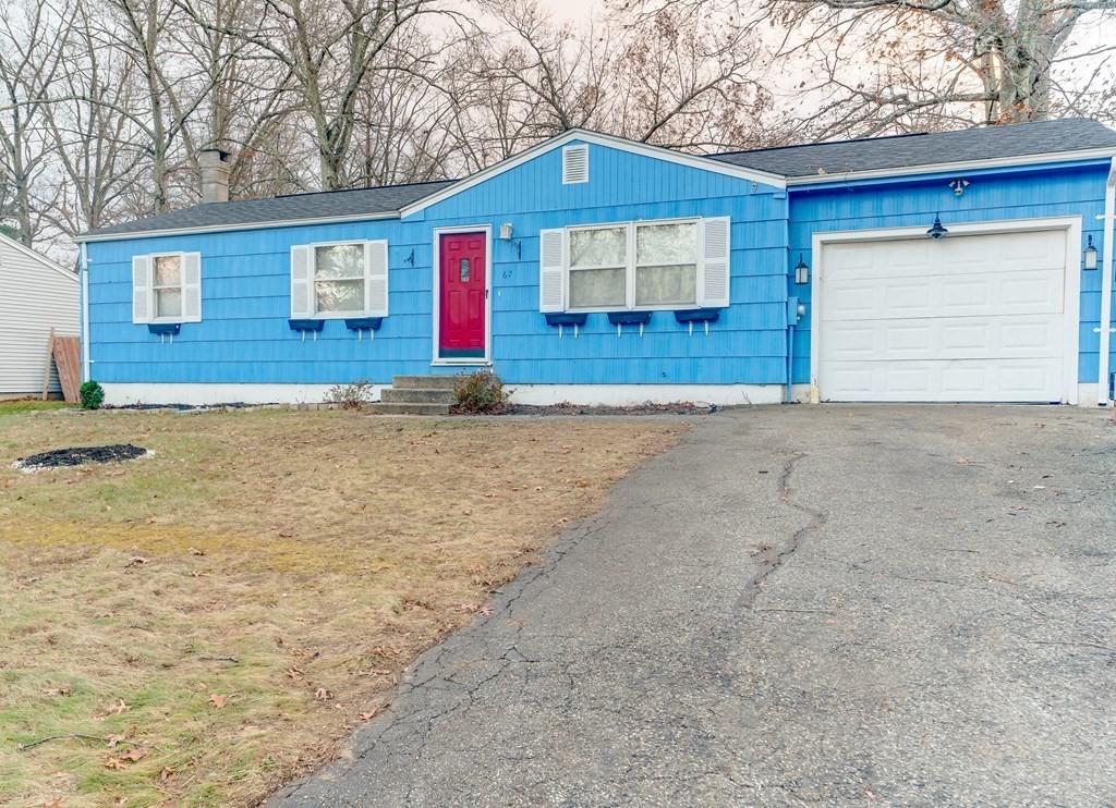 67 Sierra Vista Road Springfield, MA 01128 - Photo 3 of 21 a front view of a house with a yard and garage