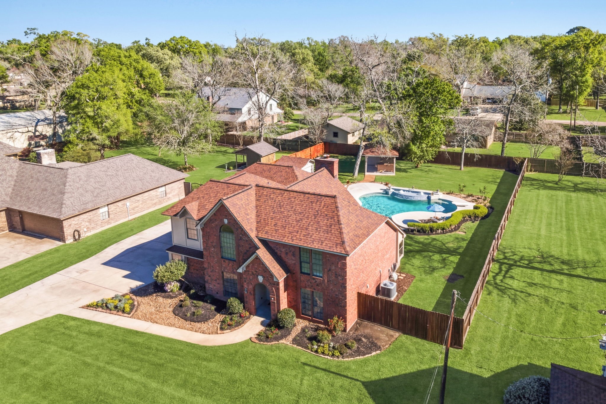 an aerial view of a house with a garden