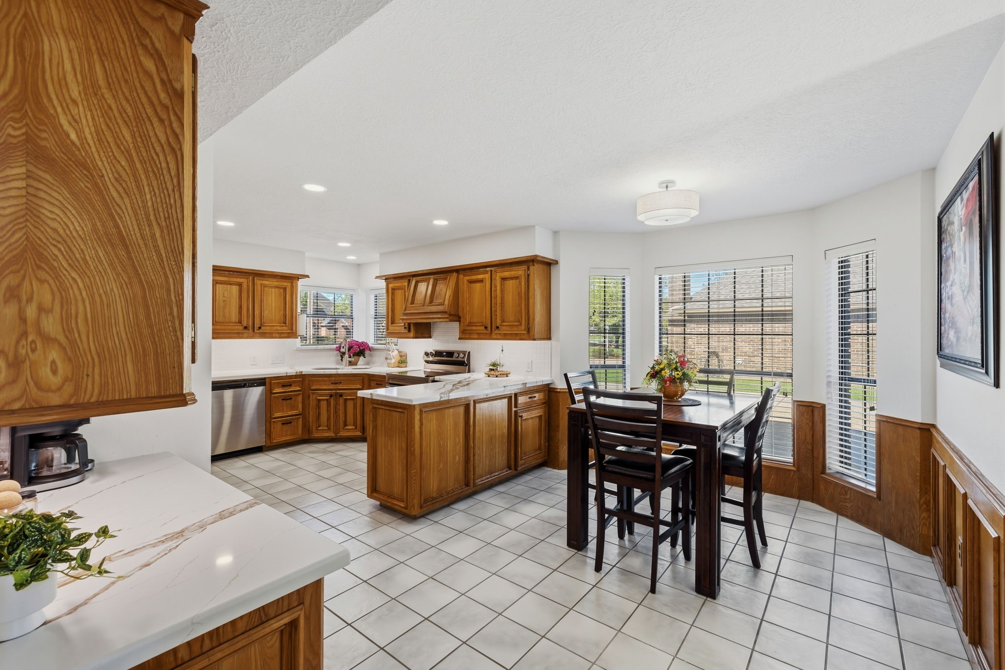 310 Pecan Loop Drive Baytown, TX 77523 - Photo 11 of 43 a kitchen with a table and chairs in it
