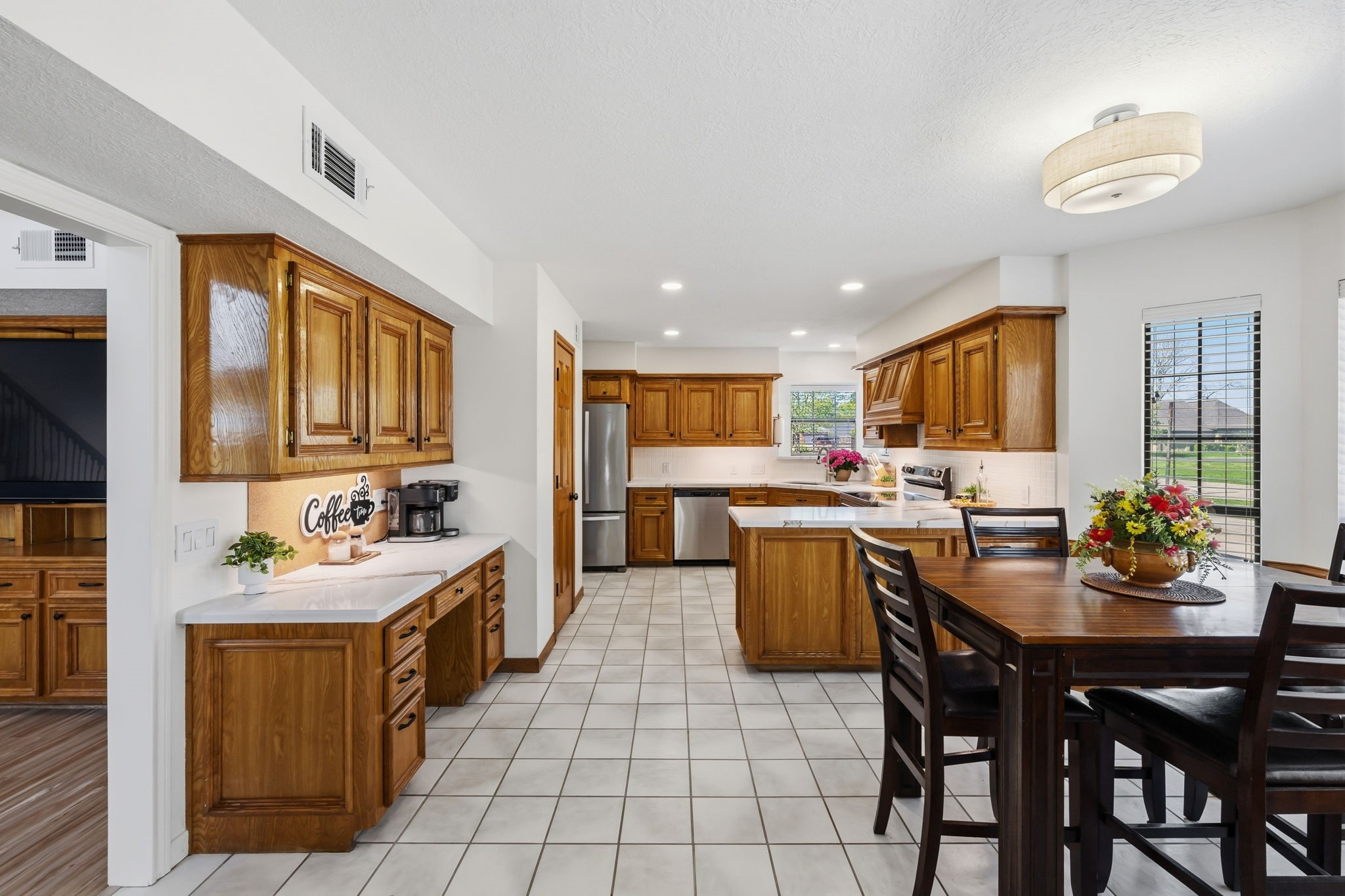 310 Pecan Loop Drive Baytown, TX 77523 - Photo 12 of 43 a kitchen with a sink and cabinets