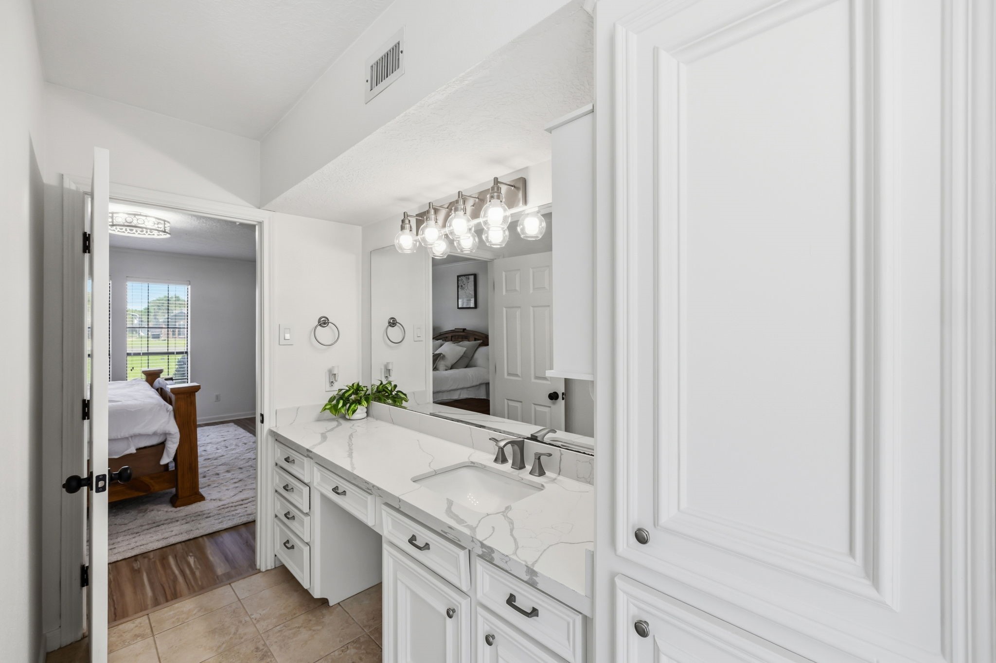 310 Pecan Loop Drive Baytown, TX 77523 - Photo 18 of 43 a bathroom with a sink and a mirror
