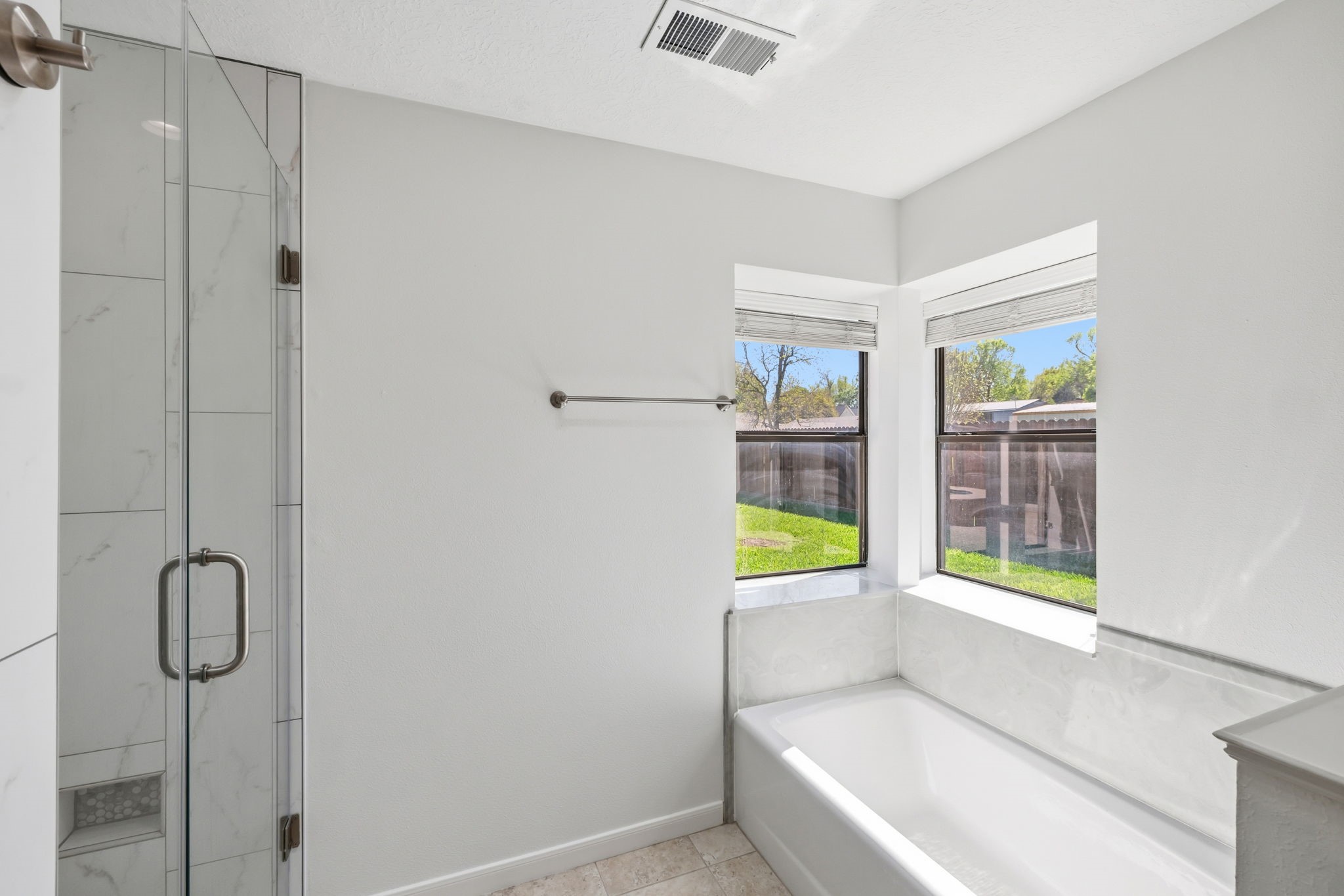 310 Pecan Loop Drive Baytown, TX 77523 - Photo 19 of 43 a bathroom with a bathtub and a shower