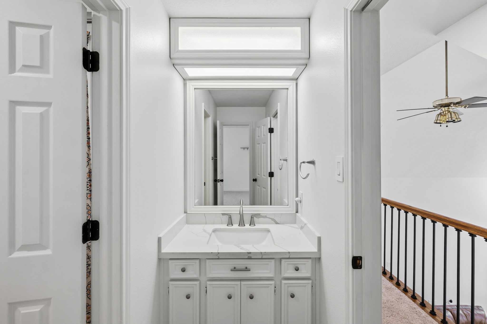 310 Pecan Loop Drive Baytown, TX 77523 - Photo 21 of 43 a bathroom with a granite countertop sink a mirror and a shower