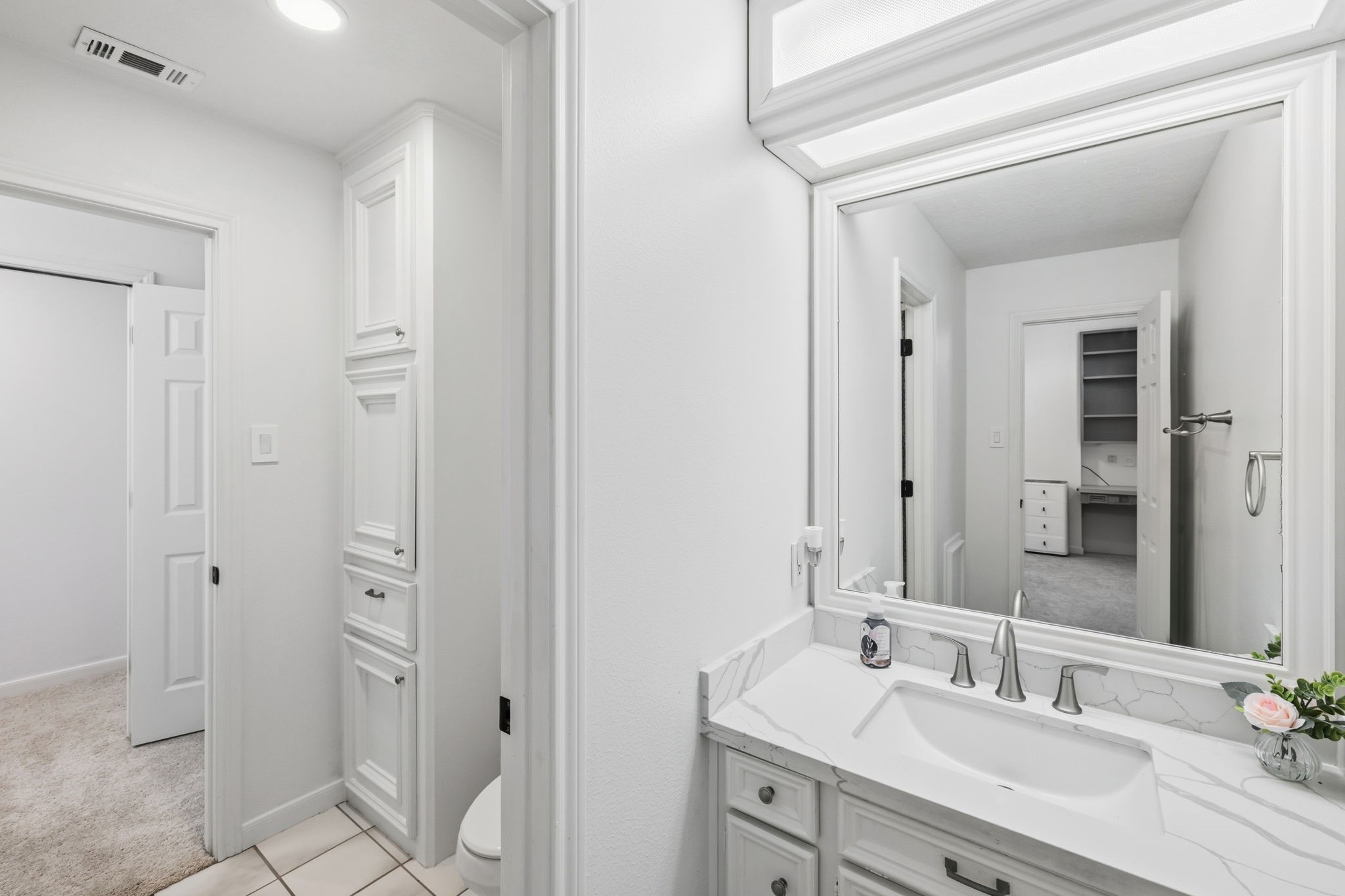 310 Pecan Loop Drive Baytown, TX 77523 - Photo 23 of 43 a bathroom with a double vanity sink mirror and shower