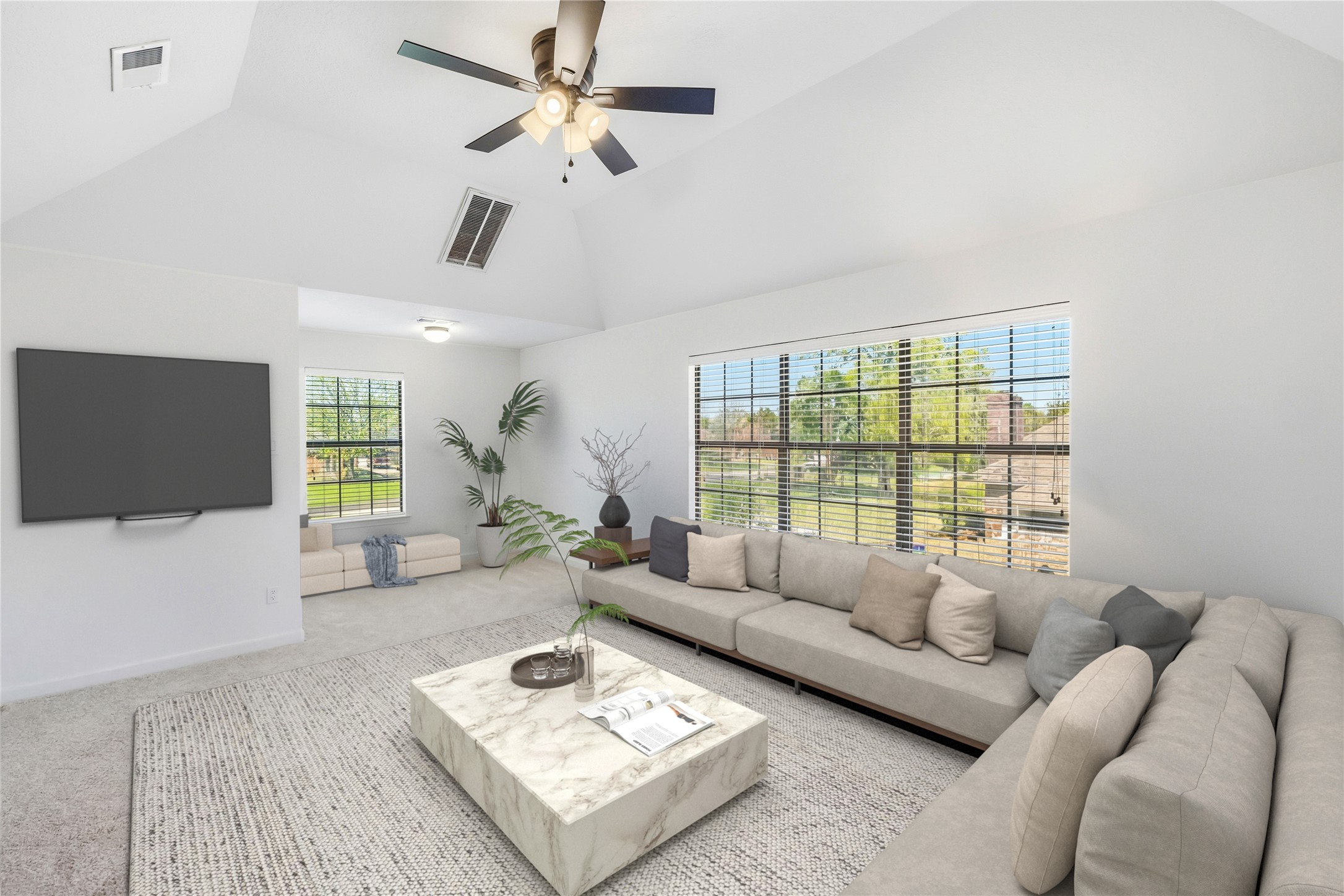 310 Pecan Loop Drive Baytown, TX 77523 - Photo 25 of 43 a living room with furniture a flat screen tv and a large window