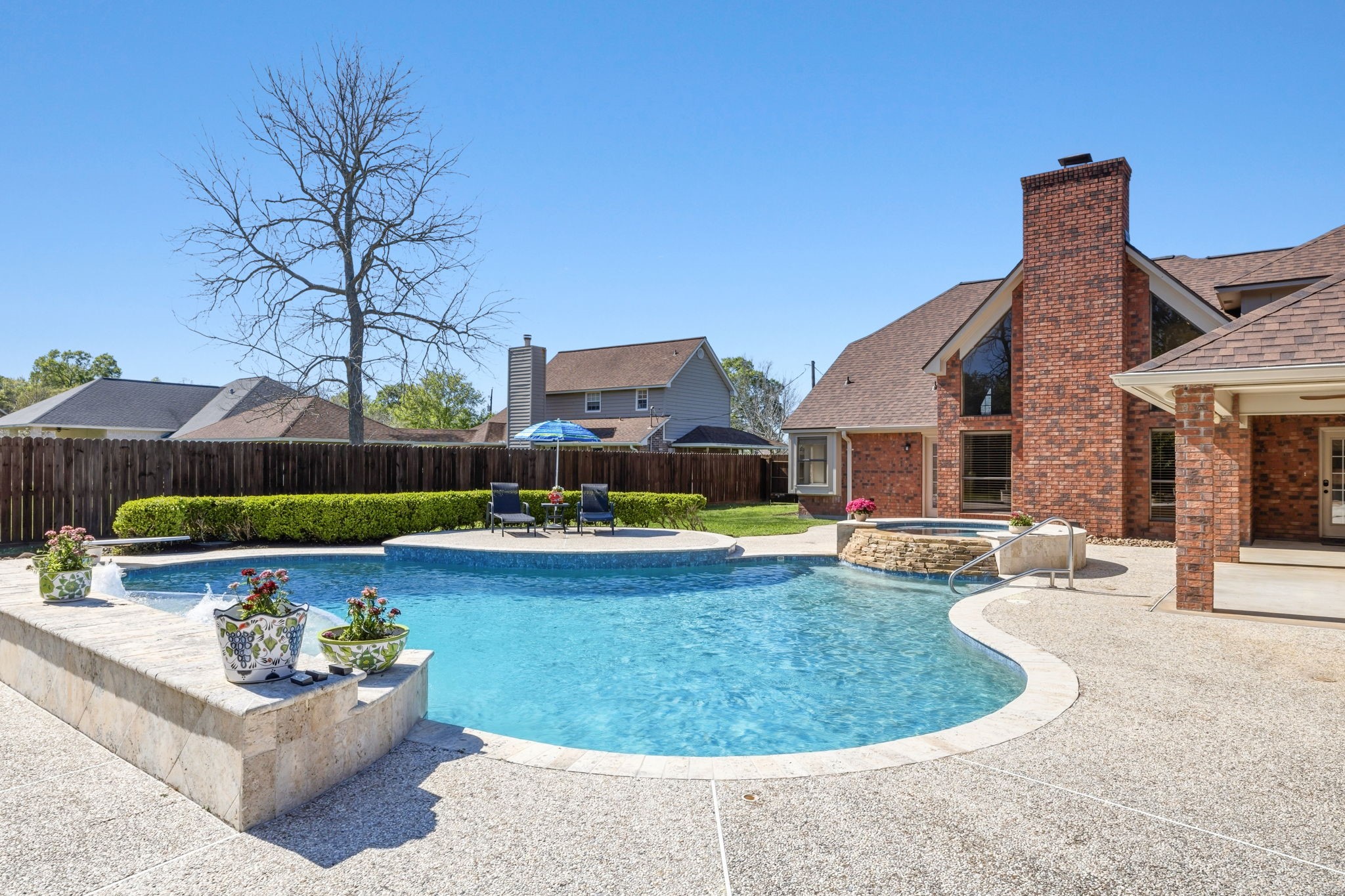 310 Pecan Loop Drive Baytown, TX 77523 - Photo 34 of 43 a view of a house with swimming pool and yard