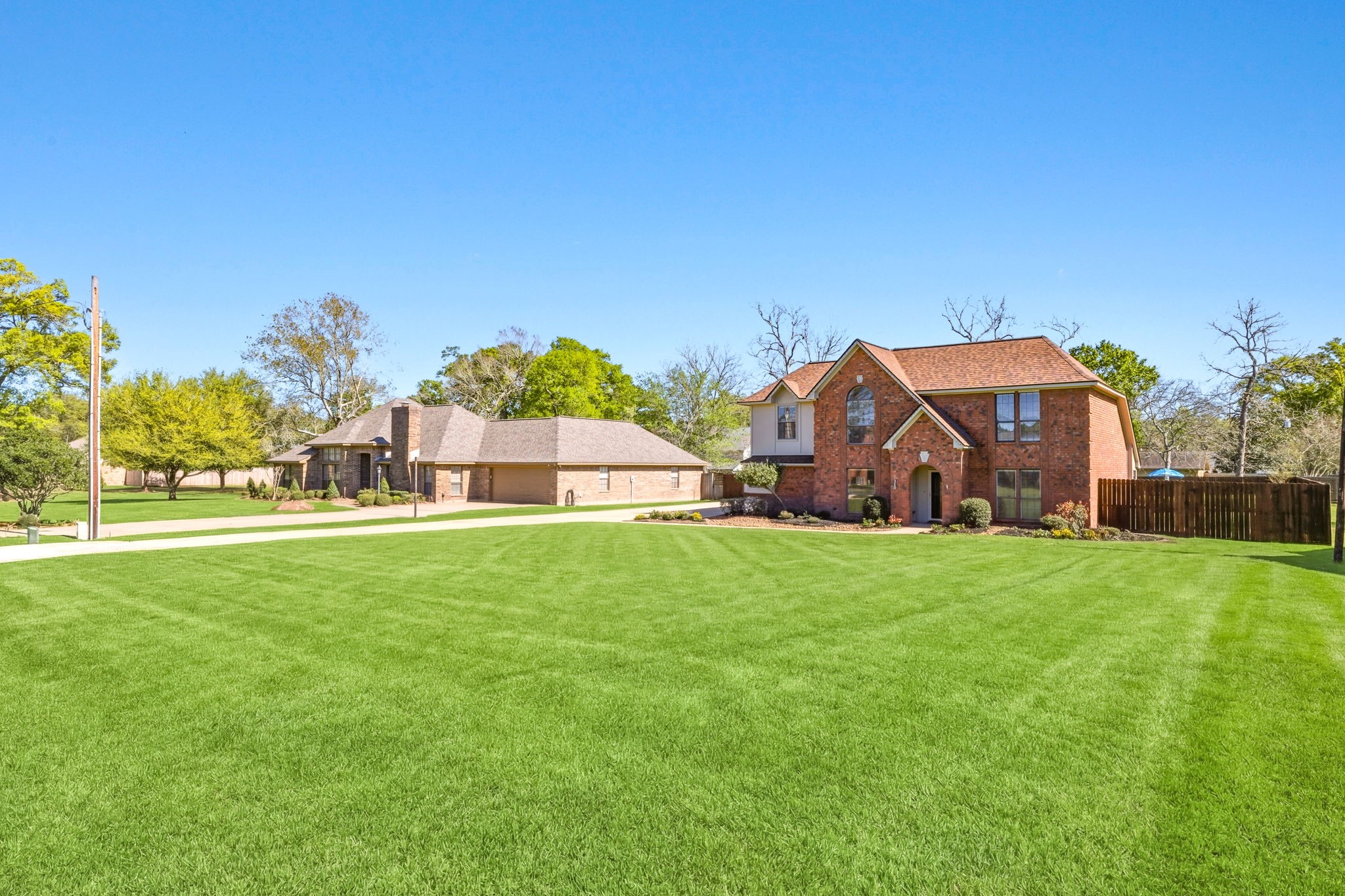 310 Pecan Loop Drive Baytown, TX 77523 - Photo 38 of 43 a view of a big house with a big yard and large trees