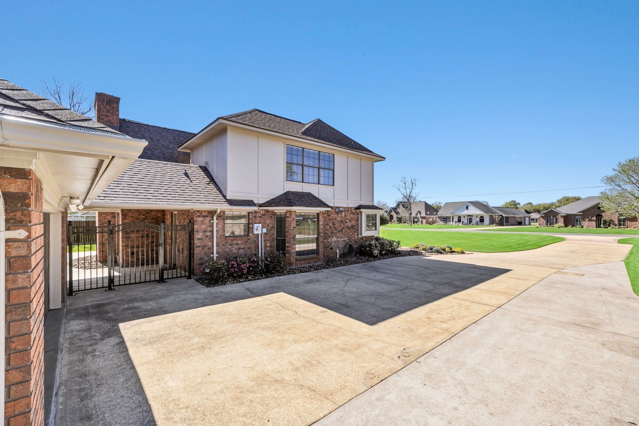 310 Pecan Loop Drive Baytown, TX 77523 - Photo 39 of 43 a front view of a house with a yard and garage
