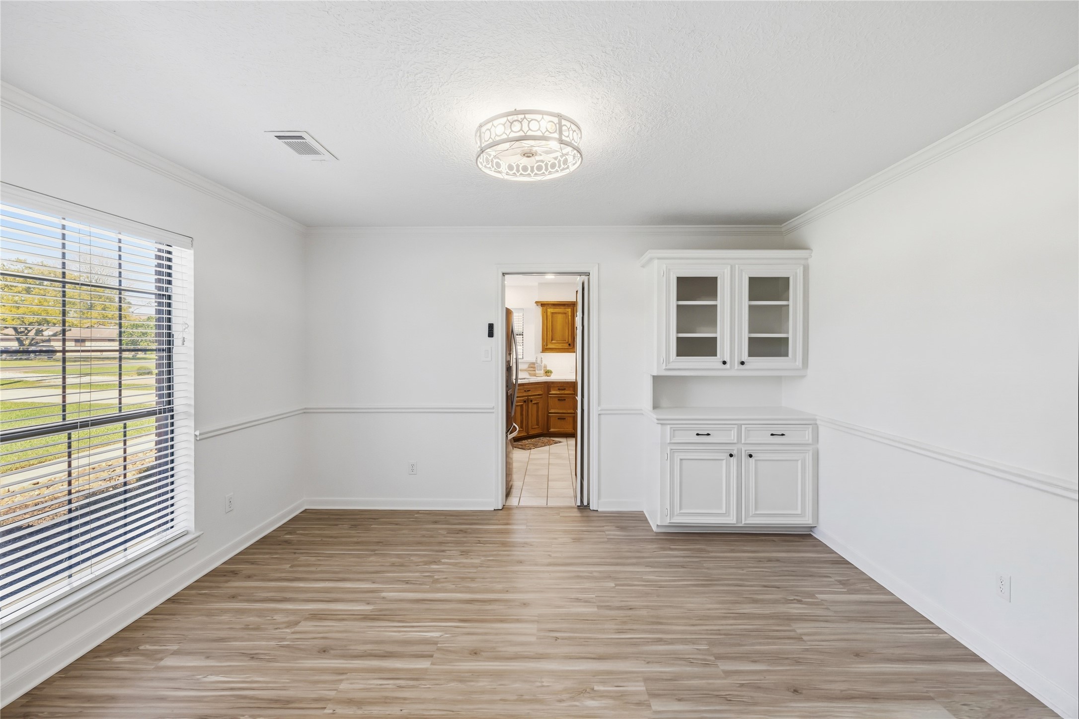 310 Pecan Loop Drive Baytown, TX 77523 - Photo 4 of 43 wooden floor in an empty room with a window
