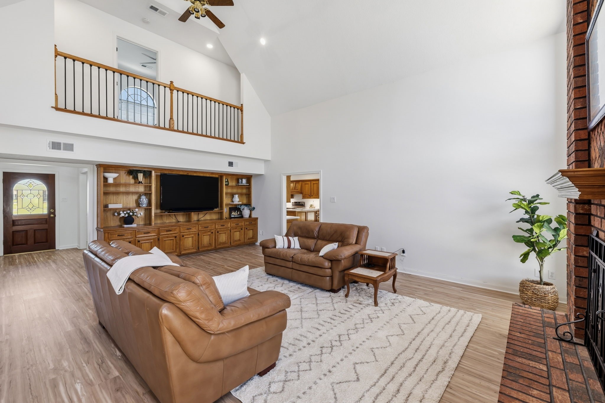 310 Pecan Loop Drive Baytown, TX 77523 - Photo 8 of 43 a living room with furniture and a fireplace