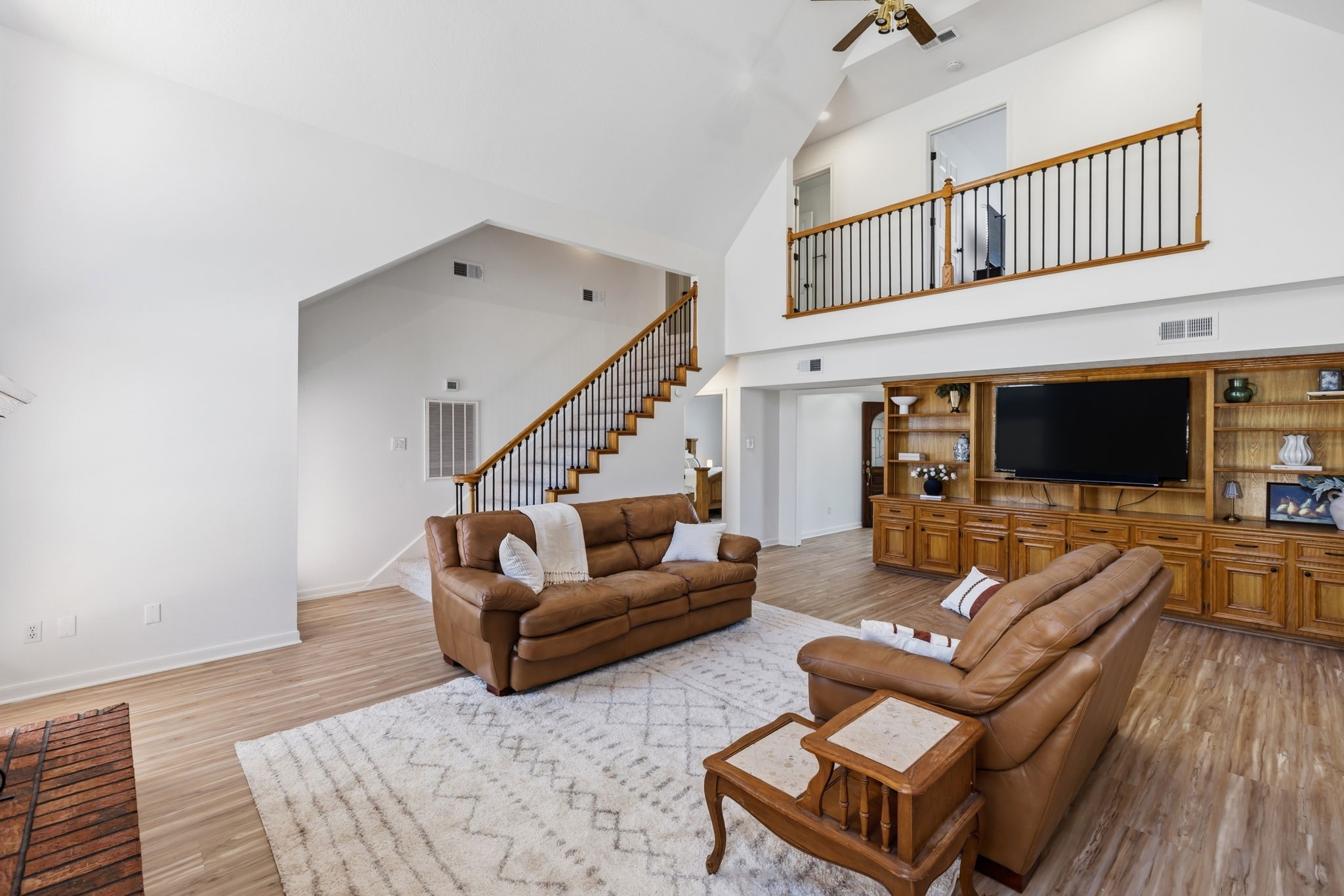 310 Pecan Loop Drive Baytown, TX 77523 - Photo 10 of 43 a living room with furniture or couch and a flat screen tv
