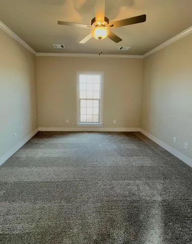 a view of room with a ceiling fan and window