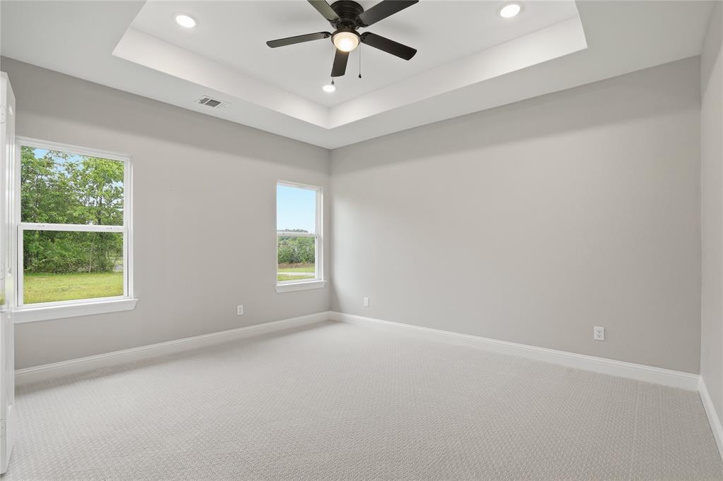 420 Ball Street Tom Bean, TX 75491 - Photo 34 of 34 an empty room with a window and a fan