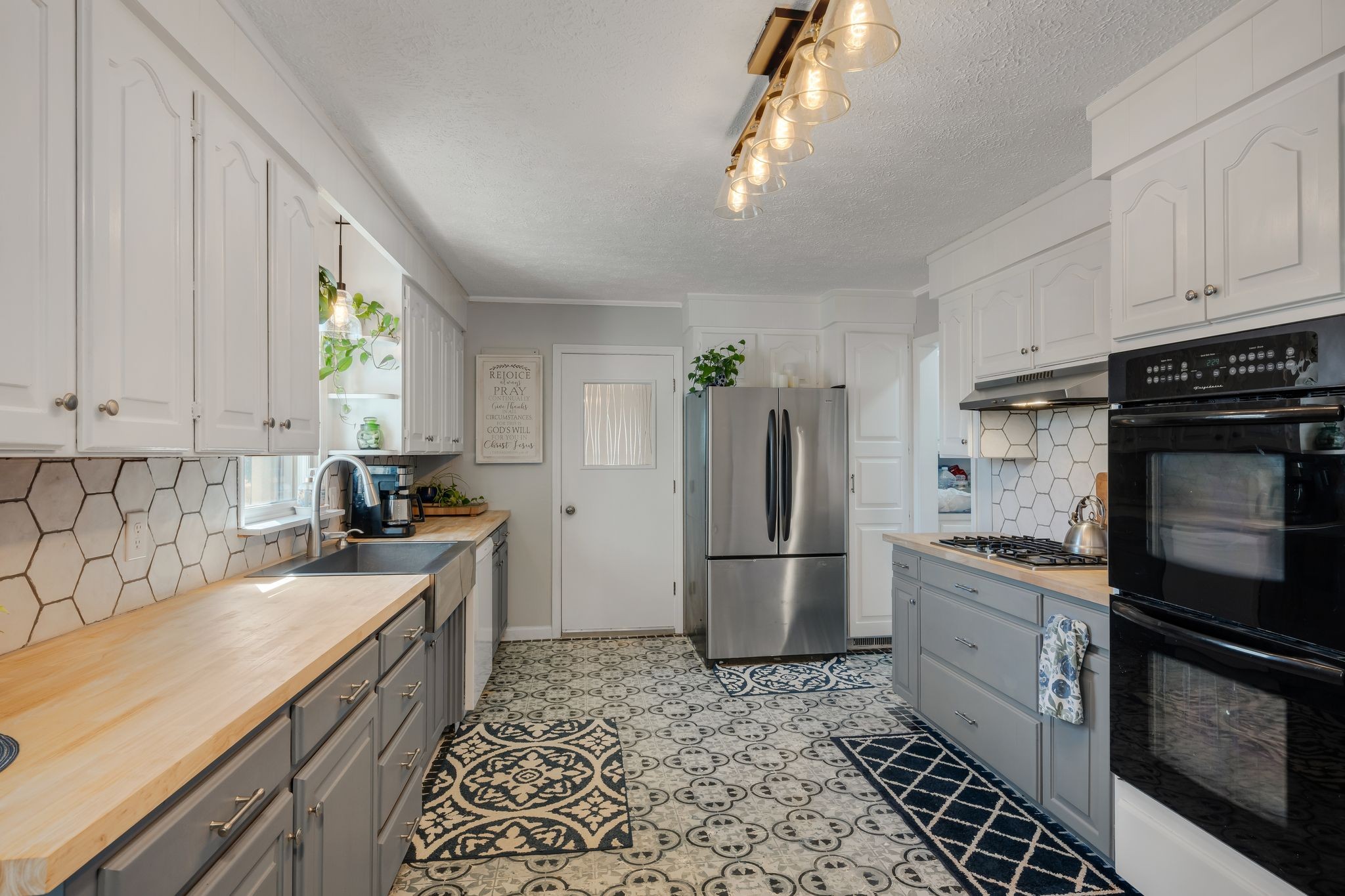 1971 Ridge Road McEwen, TN 37101 - Photo 11 of 40 a kitchen with a refrigerator a stove a sink and cabinets