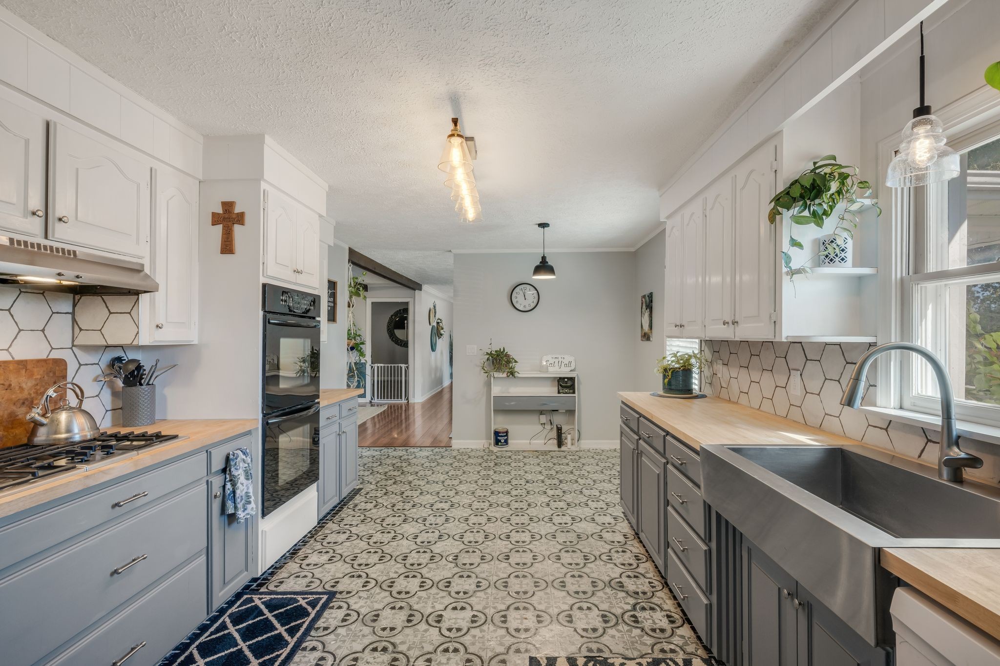 1971 Ridge Road McEwen, TN 37101 - Photo 12 of 40 a kitchen with stainless steel appliances granite countertop a sink stove and cabinets