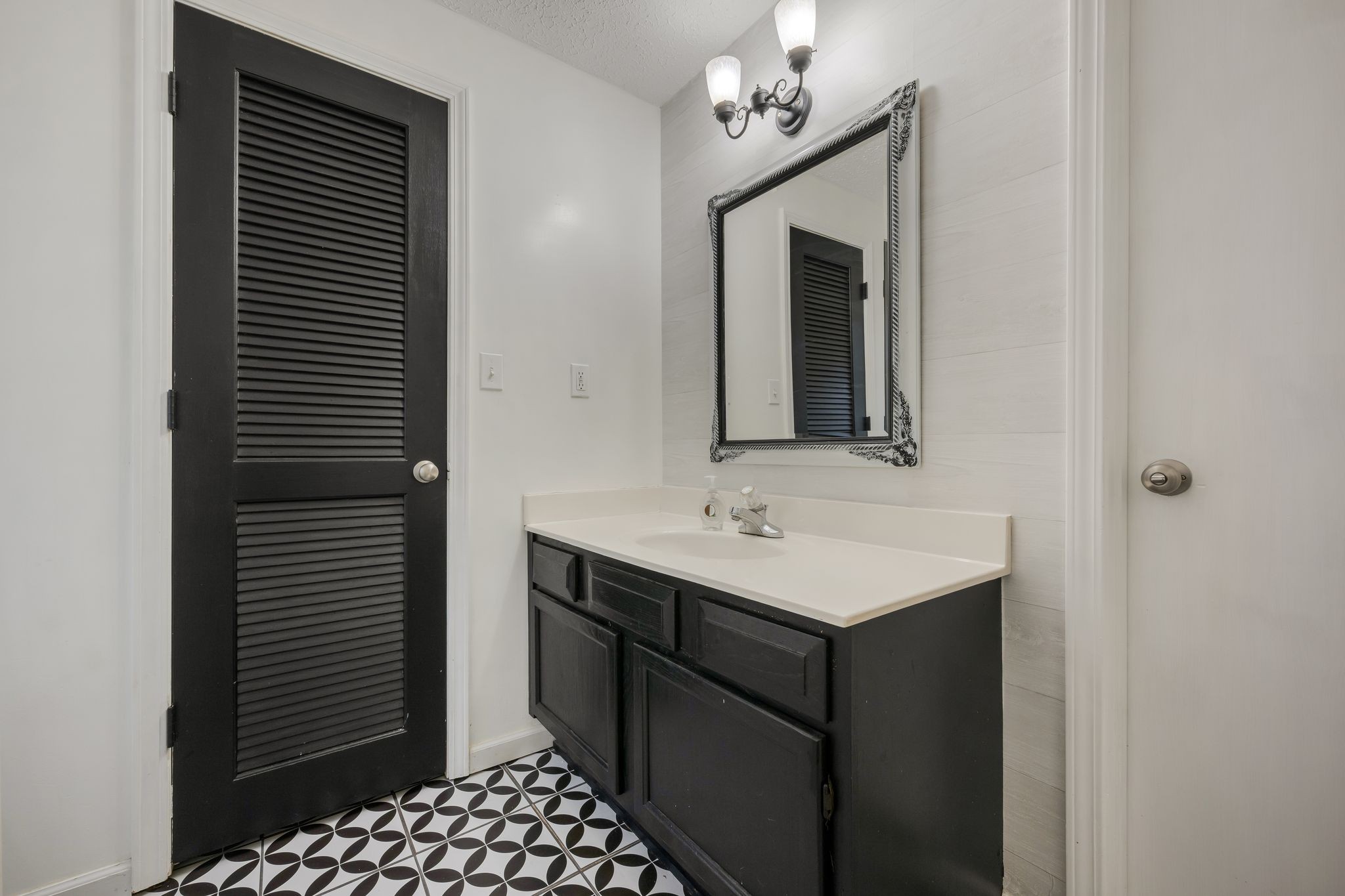 1971 Ridge Road McEwen, TN 37101 - Photo 19 of 40 a bathroom with a sink a mirror and shower