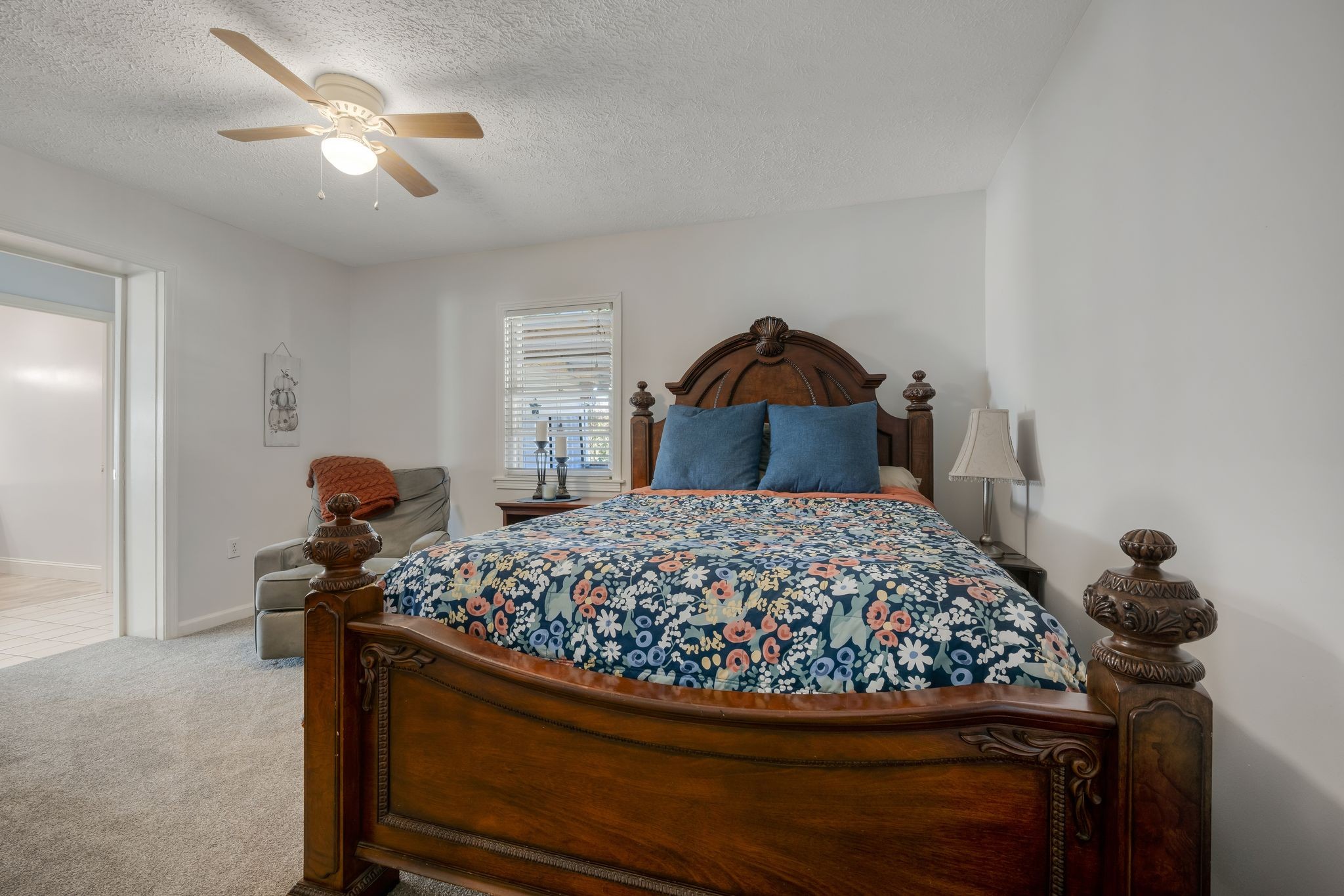 1971 Ridge Road McEwen, TN 37101 - Photo 21 of 40 a bedroom with a bed and a chandelier