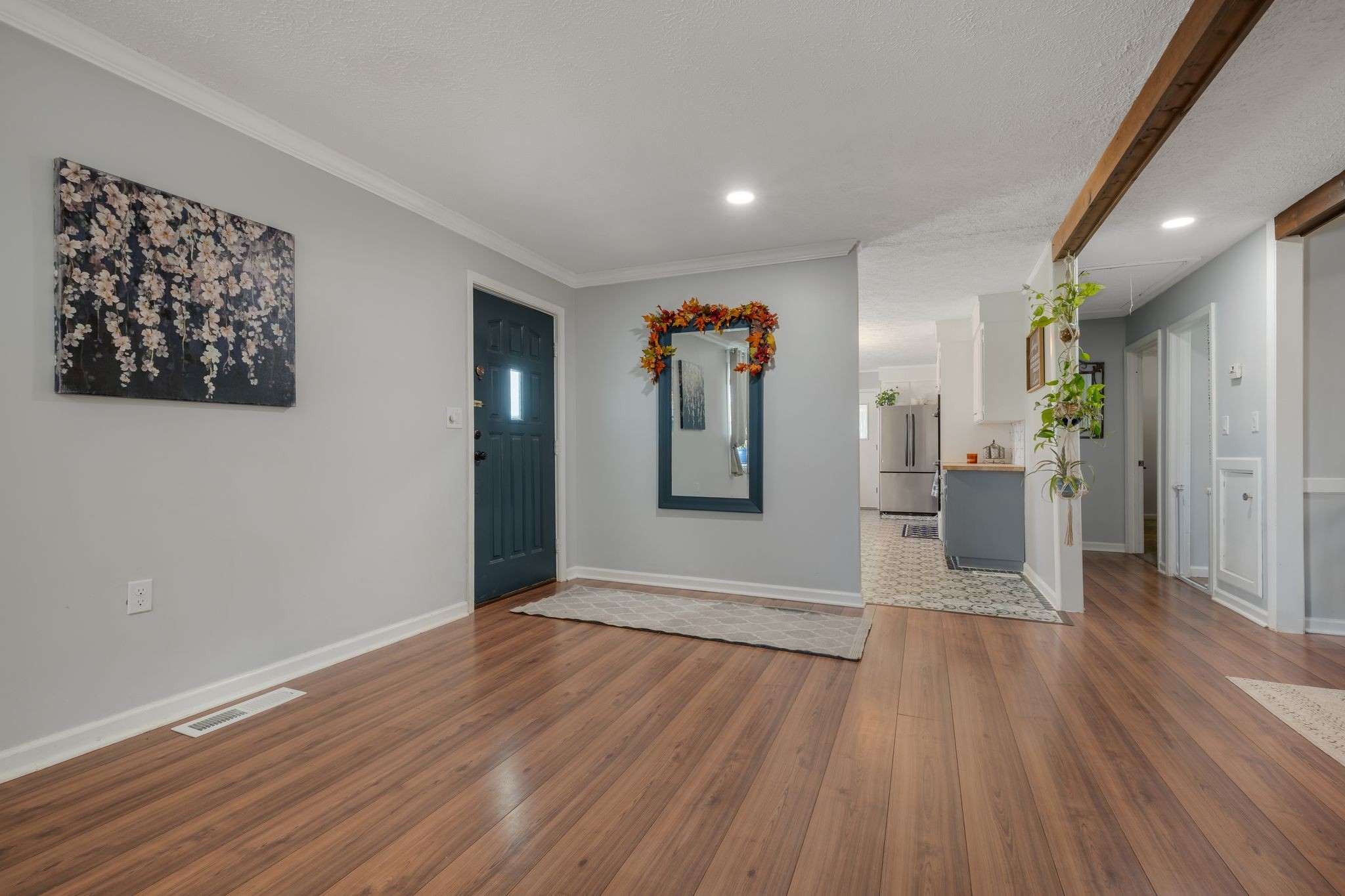 1971 Ridge Road McEwen, TN 37101 - Photo 4 of 40 a view of a hallway with wooden floor and a living room