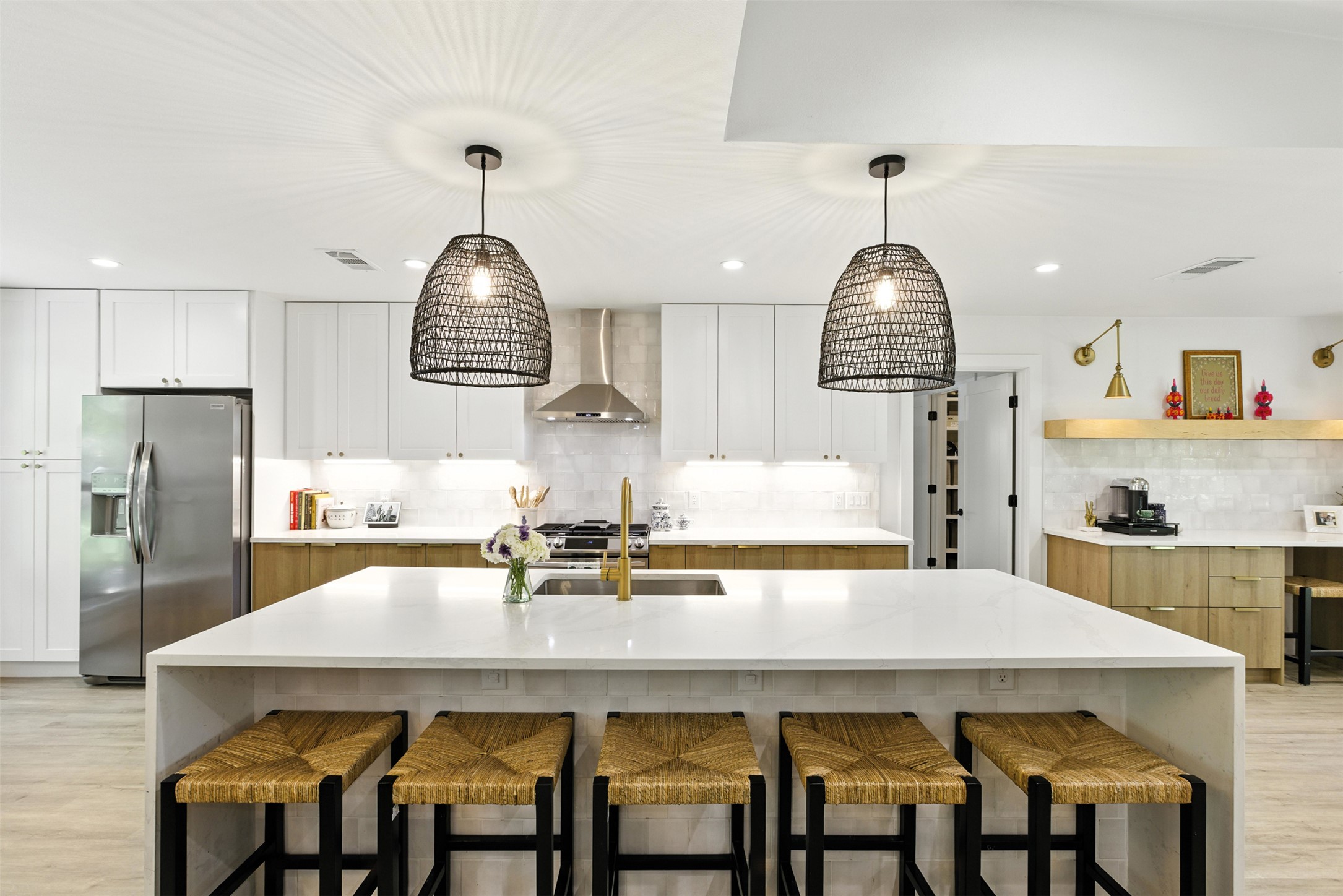 2403 Gateshead Circle Austin, TX 78745 - Photo 2 of 22 Culinary adventures await in this naturally illuminated kitchen with a spacious central island and modern fixtures.