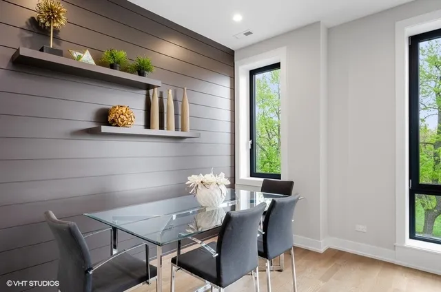 a view of a dining room with furniture and a window