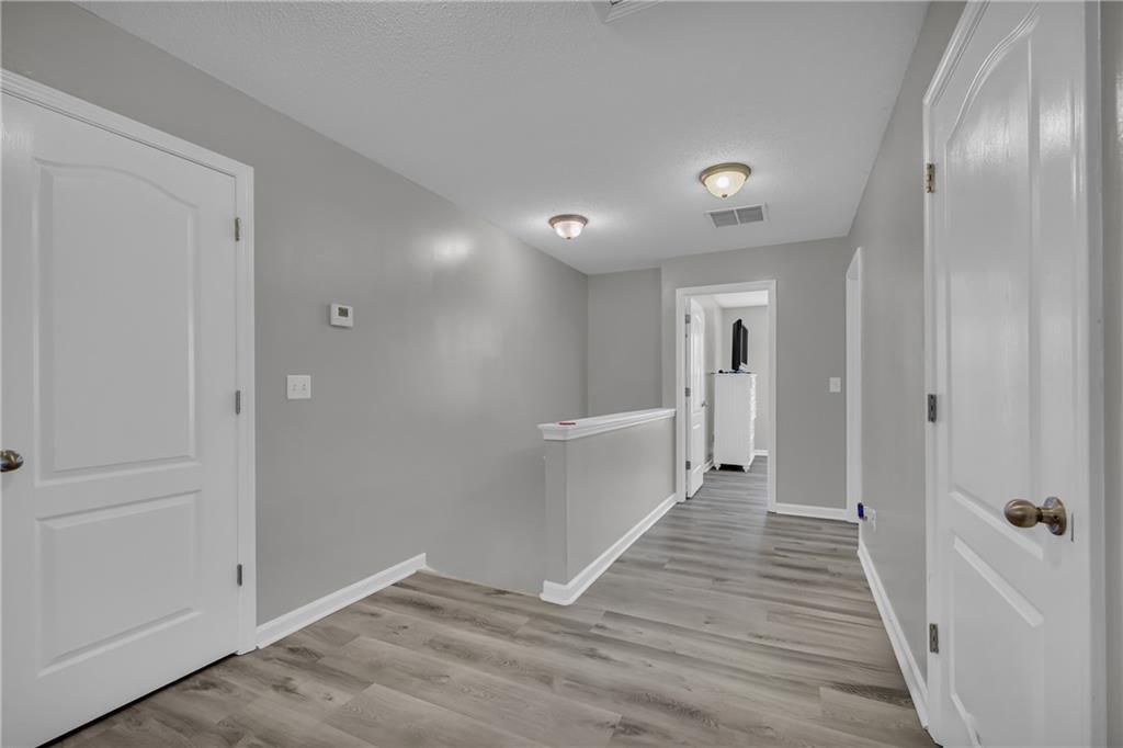 1498 Box Circle Winder, GA 30680 - Photo 26 of 56 a view of a hallway with wooden floor
