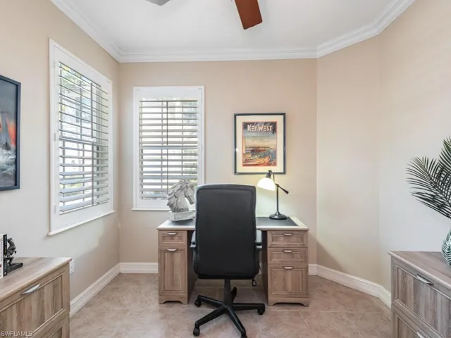 a work room with furniture and windows