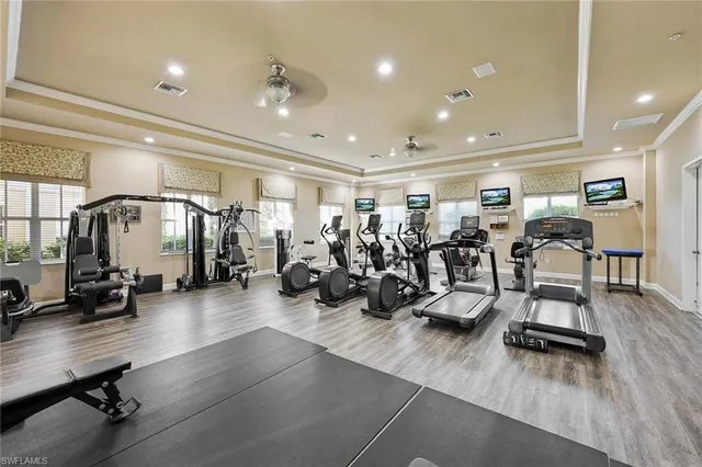 a view of a room with gym equipment and a large window