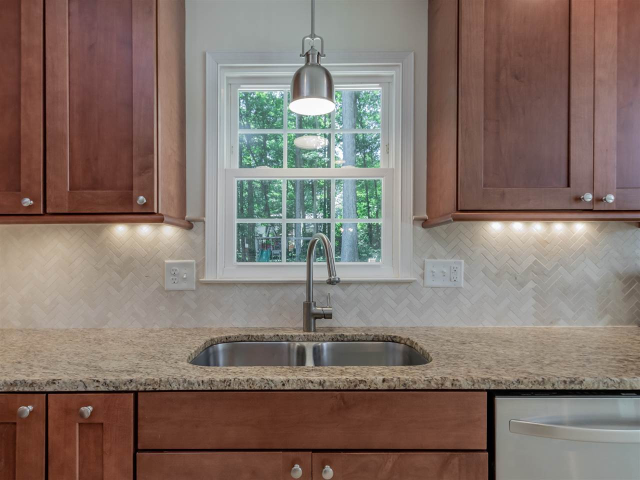 5713 Edgedale Drive Raleigh, NC 27612 - Photo 15 of 30 One more place you can enjoy your beautiful kitchen and the beautiful views of your private backyard. Kitchen View 2