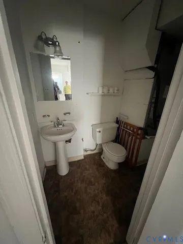 a bathroom with a sink and toilet
