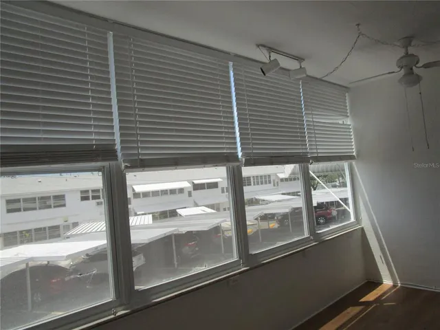 an empty room with walk in closet and a window