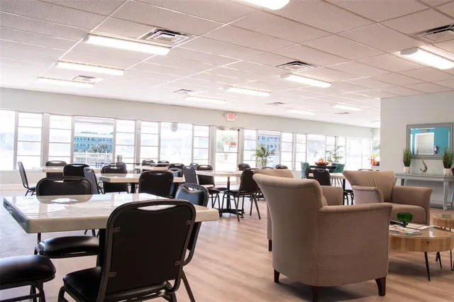 a view of a room with furniture and chandelier