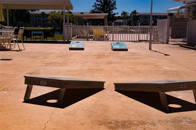 a view of a patio with table and chairs and potted plants