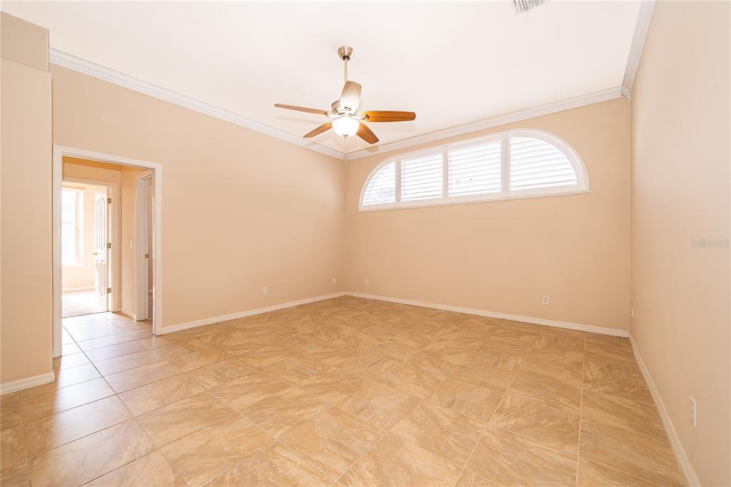 2277 Nectar Way Oviedo, FL 32765 - Photo 11 of 30 an empty room with windows and fan