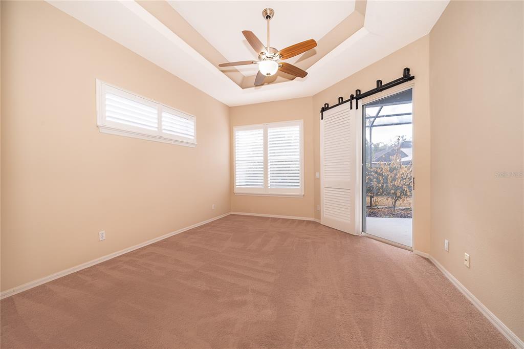 2277 Nectar Way Oviedo, FL 32765 - Photo 13 of 30 an empty room with windows and ceiling fan