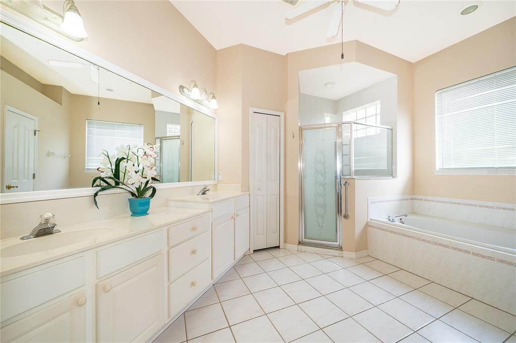 2277 Nectar Way Oviedo, FL 32765 - Photo 16 of 30 a bathroom with a double vanity sink mirror and bathtub
