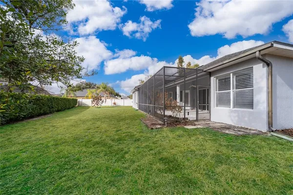 an aerial view of houses with yard