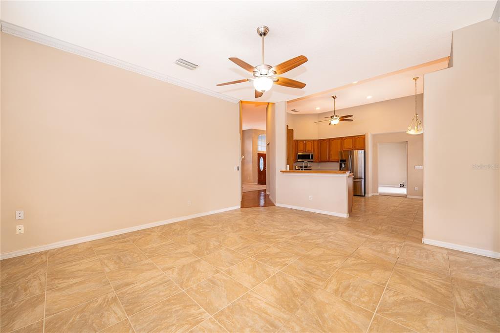2277 Nectar Way Oviedo, FL 32765 - Photo 10 of 30 a view of a kitchen with a sink and a refrigerator