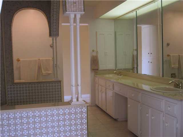 1320 Saxony Road Encinitas, CA 92024 - Photo 16 of 25 Master bath with tub and double sinks.