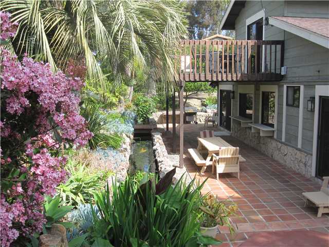 1320 Saxony Road Encinitas, CA 92024 - Photo 9 of 25 Entertainment patio and koi pond.